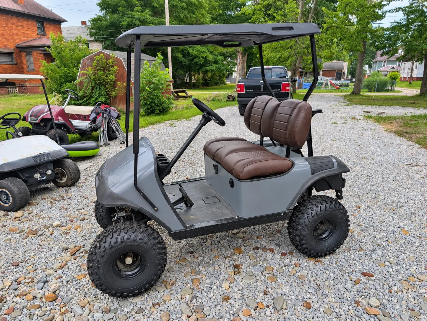 Customized lifted EZGO golf cart after restoration
